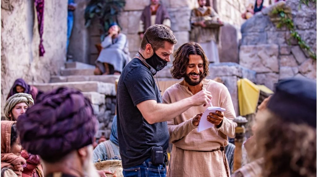 behind the scenes of the chosen, director dallas jenkins speaking with the actor playing jesus