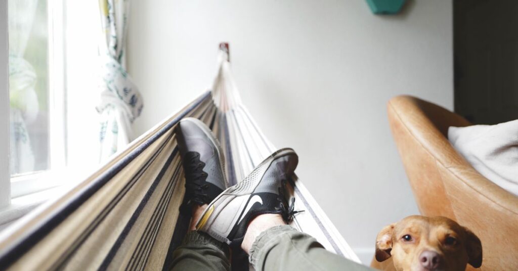 A guy resting in hammock 