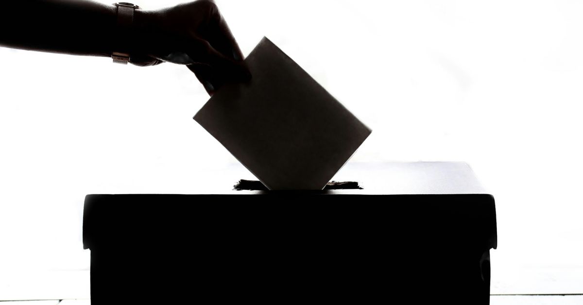 Person-casting-a-vote-in-a-ballot-box.jpg